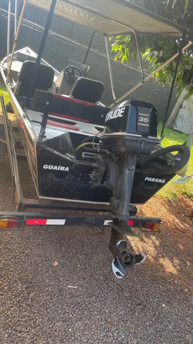 LOTE 000 - BARCO ALUMÍNIO 6 METROS CONJUNTO COM MOTOR EVINRUDE 35 HP E CARRETA PARANA REBOQUES