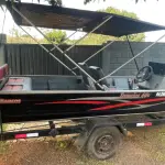 LOTE 000 - BARCO ALUMÍNIO 6 METROS CONJUNTO COM MOTOR EVINRUDE 35 HP E CARRETA PARANA REBOQUES